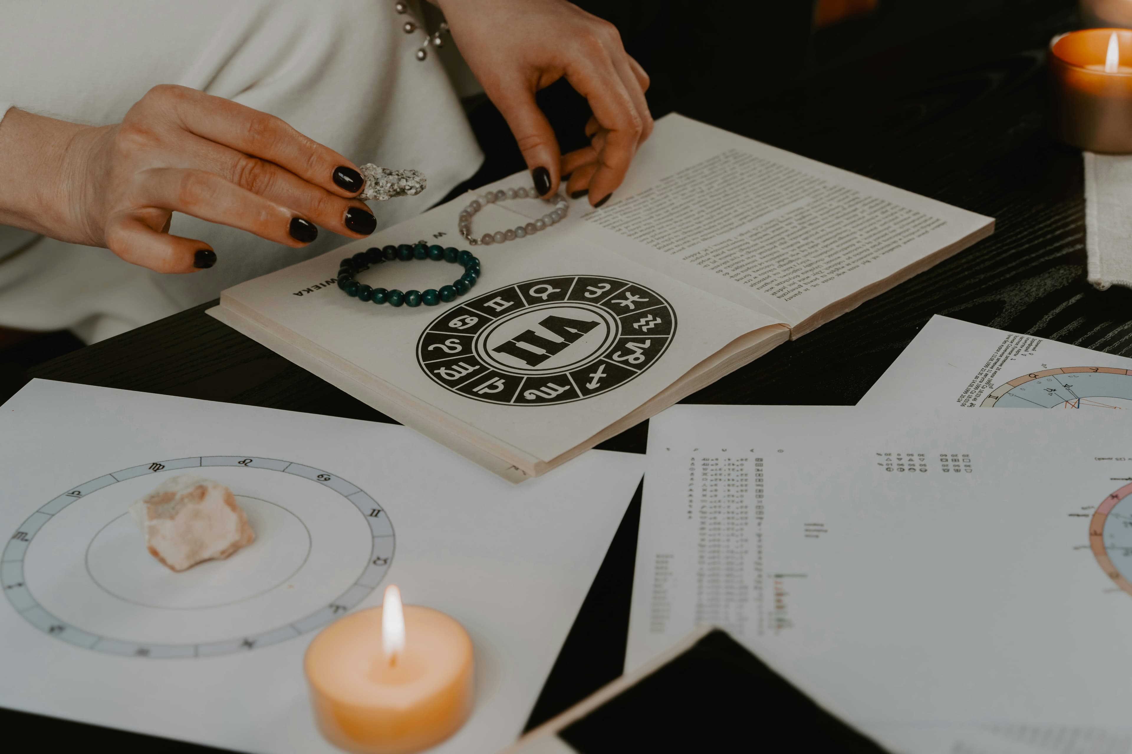 A person studying gemstones with mystical runes, representing destiny guidance.